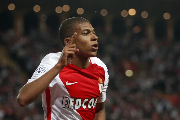 Monaco's forward Kylian MBappe Lottin celebrates his opening goal during the League One soccer match Monaco against Saint Etienne, at the Louis II stadium in Monaco, Wednesday, May 17, 2017. (AP Photo/Claude Paris)