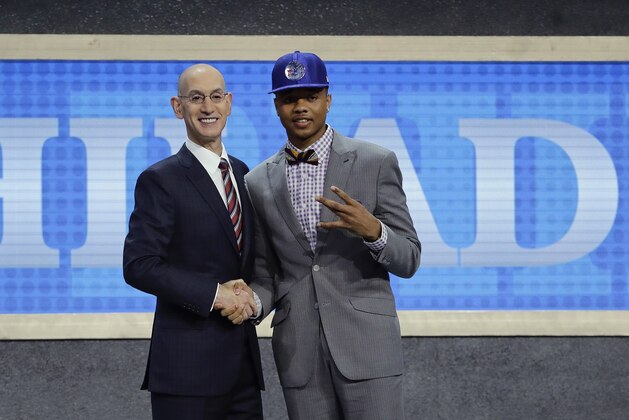 Washington's Markelle Fultz, right, poses for a photo with NBA Commissioner Adam Silver after being selected by the Philadelphia 76ers as the No. 1 pick overall during the NBA basketball draft, Thursday, June 22, 2017, in New York. (AP Photo/Frank Franklin II)