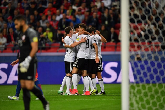 Germany's midfielder Lars Stindl (hidden) celebrates with teammates after scoring a goal during the 2017 Confederations Cup group B football match between Germany and Chile at the Kazan Arena Stadium in Kazan on June 22, 2017. / AFP PHOTO / Yuri CORTEZ        (Photo credit should read YURI CORTEZ/AFP/Getty Images)
