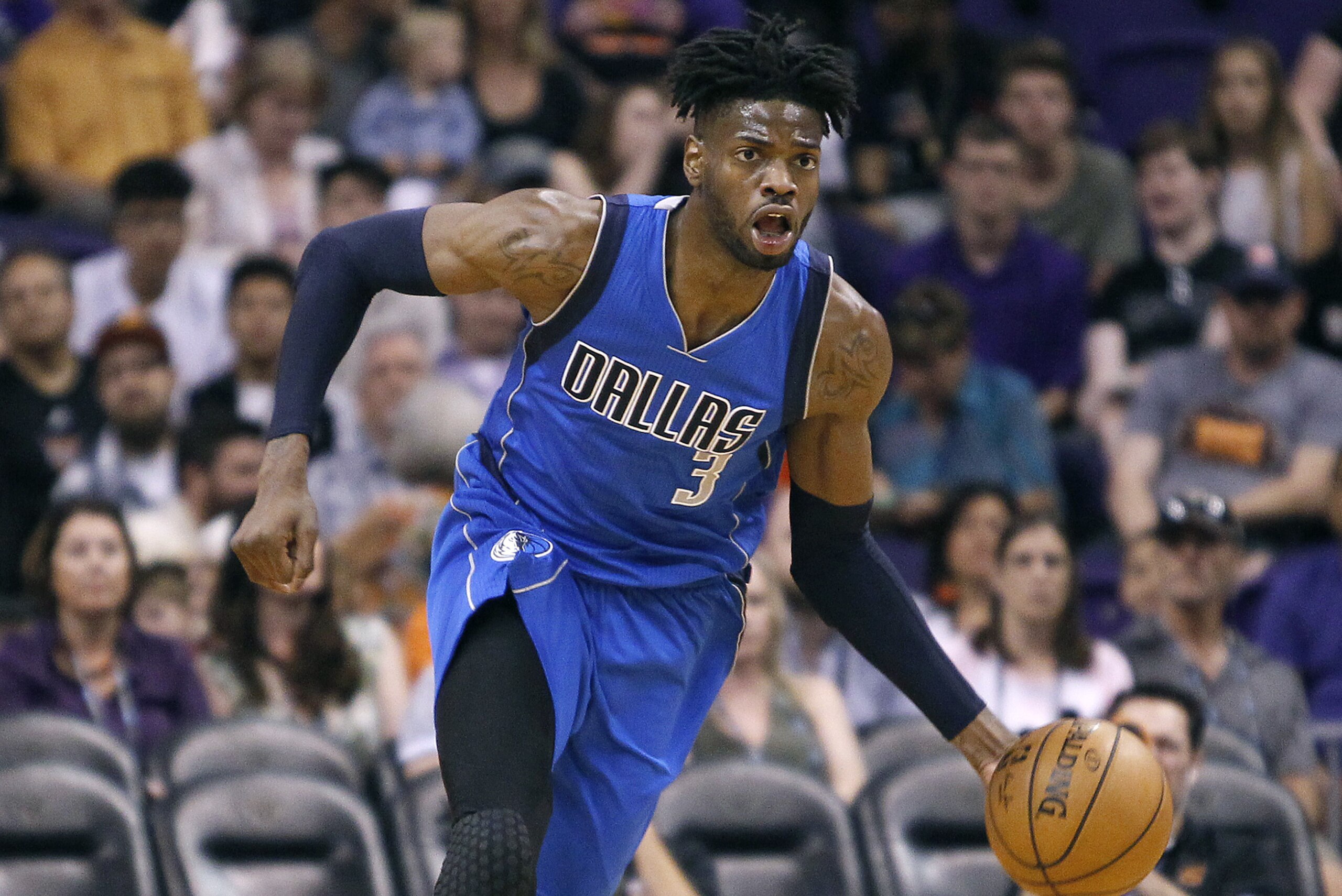 Dallas Mavericks forward Nerlens Noel advances the ball up court during the first half of an NBA basketball game against the Phoenix Suns, Sunday, April 9, 2017, in Phoenix. The Suns defeated the Mavericks 124-111. (AP Photo/Ralph Freso)