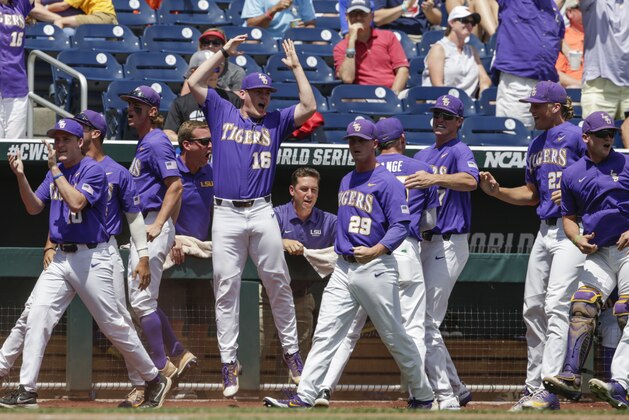 LSU players including Jared Poche' (16) celebrate after Michael Papierski scored a three-run home run against Oregon State in the third inning of an NCAA College World Series baseball elimination game in Omaha, Neb., Saturday, June 24, 2017. (AP Photo/Nati Harnik)