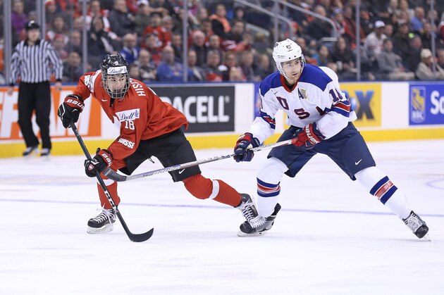 TORONTO, ON - JANUARY 2:  Colin White #18 of Team USA skates against Nico Hischier #18 of Team Switzerland during a QuarterFinal game at the 2017 IIHF World Junior Hockey Championships at Air Canada Centre on January 2, 2017 in Toronto, Ontario, Canada. Team USA defeated Team Switzerland 3-2. (Photo by Claus Andersen/Getty Images)