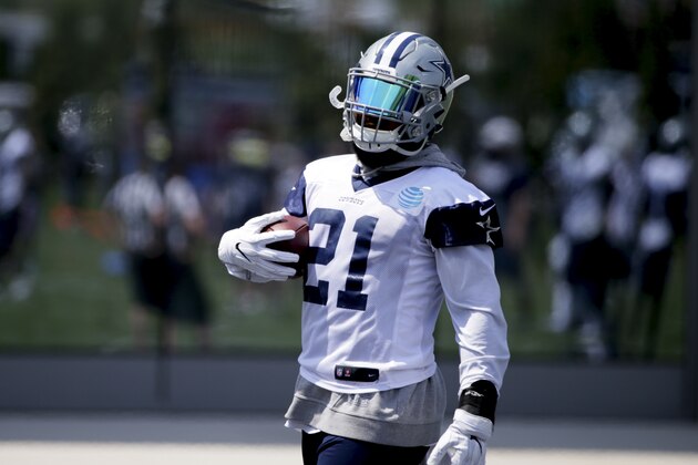 Dallas Cowboys running back Ezekiel Elliott (21) carries a football during an organized team activity at its NFL football training facility in Frisco, Texas, Wednesday, May 31, 2017. (AP Photo/LM Otero) Dallas Cowboys running back Ezekiel Elliott (21) carries a football during an organized team activity at its NFL football training facility in Frisco, Texas, Wednesday, May 31, 2017. (AP Photo/LM Otero)