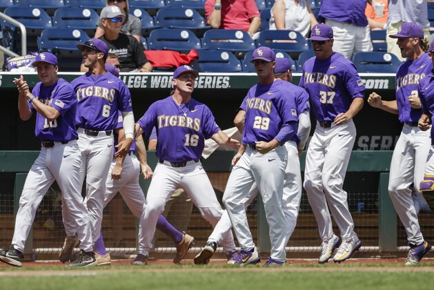 LSU players, including Jared Poche (16), celebrate after Michael Papierski scored a three-run home run against Oregon State in the third inning of an NCAA College World Series baseball elimination game in Omaha, Neb., Saturday, June 24, 2017. (AP Photo/Nati Harnik)