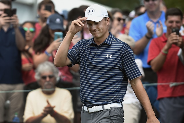 Jordan Spieth tips his hat to fans as he is introduced at the first hole during the final round of the Travelers Championship golf tournament, Sunday, June 25, 2017, in Cromwell, Conn. (AP Photo/Jessica Hill)