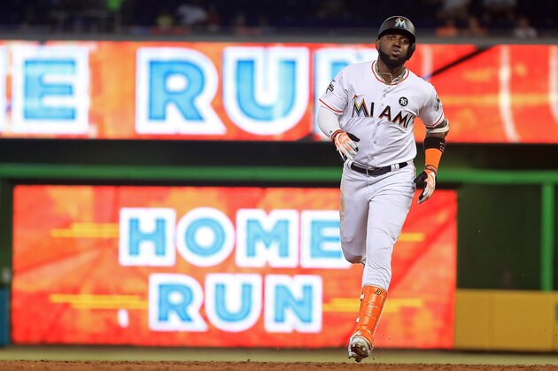 MIAMI, FL - JUNE 14:  Marcell Ozuna #13 of the Miami Marlins rounds the bases after hitting a solo home run during a game against the Oakland Athletics at Marlins Park on June 14, 2017 in Miami, Florida.  (Photo by Mike Ehrmann/Getty Images)