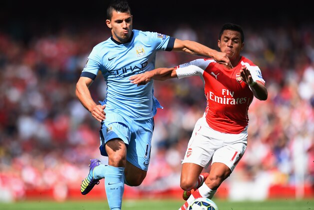 LONDON, ENGLAND - SEPTEMBER 13:  Sergio Aguero of Manchester City and Alexis Sanchez of Arsenal battle for the ball during the Barclays Premier League match between Arsenal and Manchester City at Emirates Stadium on September 13, 2014 in London, England.  (Photo by Shaun Botterill/Getty Images)