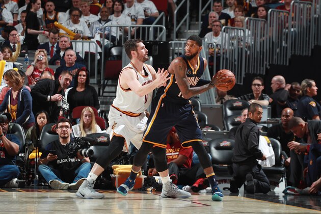 CLEVELAND, OH - APRIL 15:  Paul George #13 of the Indiana Pacers handles the ball against Kevin Love #0 of the Cleveland Cavaliers during a game in Round One of the Eastern Conference Playoffs during the 2017 NBA Playoffs on April 15, 2017 at Quicken Loans Arena in Cleveland, Ohio. NOTE TO USER: User expressly acknowledges and agrees that, by downloading and/or using this photograph, user is consenting to the terms and conditions of the Getty Images License Agreement. Mandatory Copyright Notice: Copyright 2017 NBAE  (Photo by Jeff Haynes/NBAE via Getty Images)