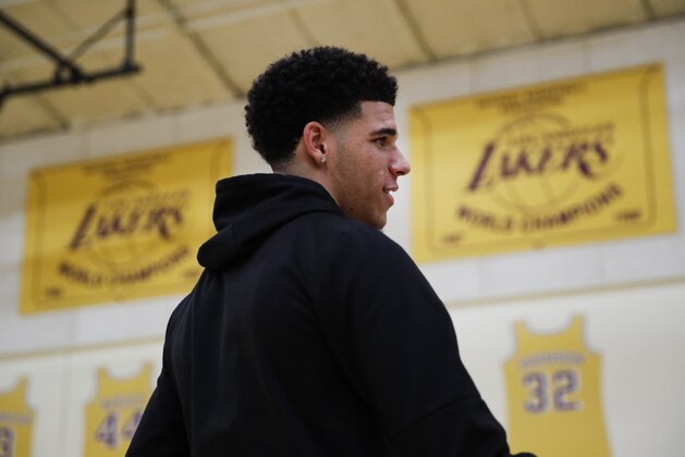 Los Angeles Lakers draft pick Lonzo Ball talks to a reporter after a news conference, Friday, June 23, 2017, in El Segundo, Calif. (AP Photo/Jae C. Hong)