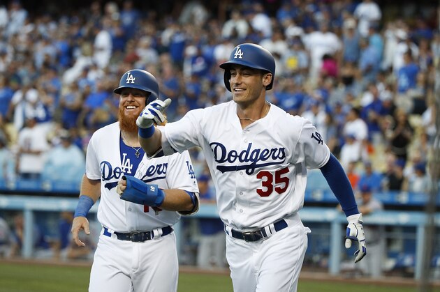 Los Angeles Dodgers' Cody Bellinger, right, and Justin Turner celebrate Bellinger's two-run home run during the first inning of a baseball game against the New York Mets, Tuesday, June 20, 2017, in Los Angeles. (AP Photo/Jae C. Hong)