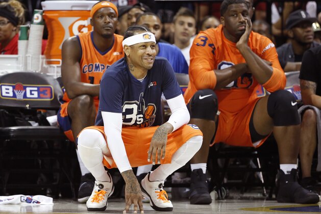 3's Company player/captain and coach Allen Iverson, center, kneels on the sideline during the first half of Game 3 in the BIG3 Basketball League debut, Sunday, June 25, 2017, at the Barclays Center in New York. (AP Photo/Kathy Willens)