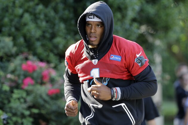 Carolina Panthers' Cam Newton walks to practice during the NFL football team's minicamp in Charlotte, N.C., Wednesday, June 14, 2017. (AP Photo/Chuck Burton)