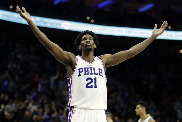 FILE - In this Jan. 27, 2017, file photo, Philadelphia 76ers' Joel Embiid reacts during an NBA basketball game against the Houston Rockets in Philadelphia. Embiid's numbers are the best in the rookie class. Yet his rookie of the year chances seem very flawed for this reason: Embiid will miss nearly two-thirds of Philadelphia's season because of injuries. (AP Photo/Matt Slocum, File)