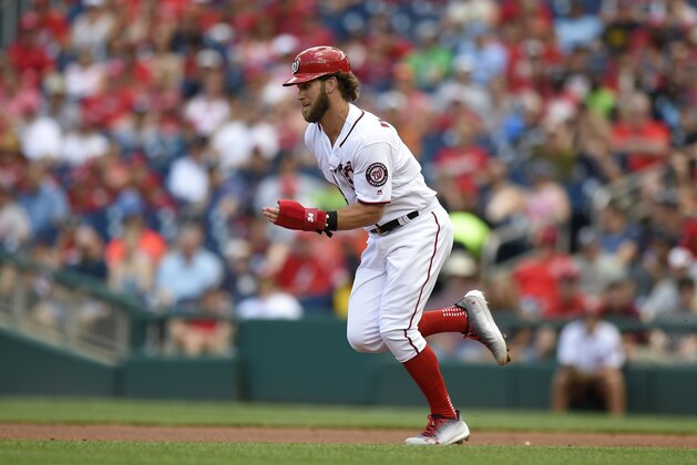 Washington Nationals' Bryce Harper runs towards second on a wild pitch during the first inning of a baseball game against the Cincinnati Reds, Sunday, June 25, 2017, in Washington. (AP Photo/Nick Wass)