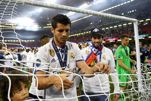 CARDIFF, WALES - JUNE 03: Alvaro Morata of Real Madrid cuts the net after the UEFA Champions League Final between Juventus and Real Madrid at National Stadium of Wales on June 3, 2017 in Cardiff, Wales.  (Photo by Shaun Botterill/Getty Images)