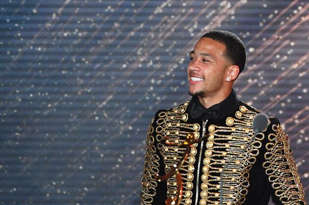 Lyon's Dutch forward Memphis Depay reacts after receiving the award of the Goal of the Year during the 26th edition of the UNFP (French National Professional Football players' Union) trophies ceremony at the Pavillon d'Armenonville in Paris, on May 15, 2017. / AFP PHOTO / FRANCK FIFE        (Photo credit should read FRANCK FIFE/AFP/Getty Images)