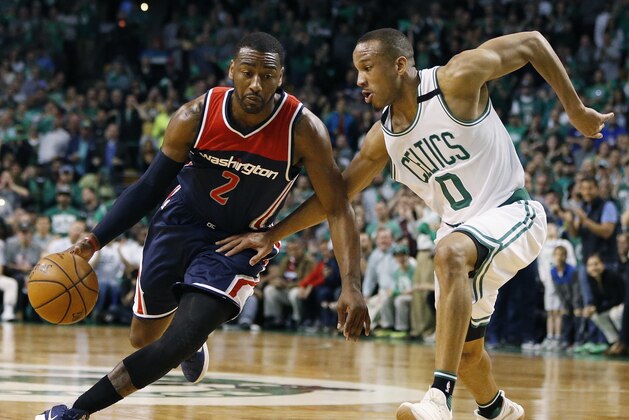 FILE - In this April 30, 2017, file photo, John Wall (2) drives against Boston Celtics' Avery Bradley (0) during the third quarter of a second-round NBA playoff series basketball game, in Boston. As much as Isaiah Thomas has been the engine for the Celtics on offense this postseason, Avery Bradley has been counted on just as much on the defensive side of the ball. (AP Photo/Michael Dwyer, File)