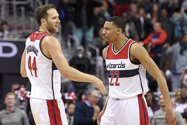 Washington Wizards guard Bojan Bogdanovic (44), of Bosnia and Herzegovina, reacts with Washington Wizards forward Otto Porter Jr. (22) after he hit a 3-pointer late in the second half of an NBA basketball game against the Orlando Magic, Sunday, March 5, 2017, in Washington. The Wizards won 115-114. (AP Photo/Nick Wass)