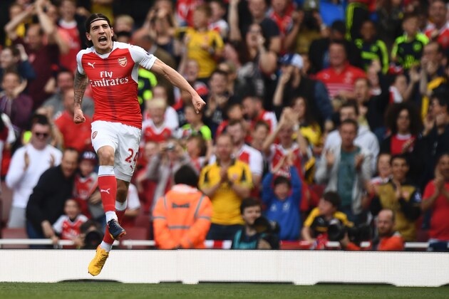 Arsenal's Spanish defender Hector Bellerin celerbates scoring their opening goal during the English Premier League football match between Arsenal and Everton at the Emirates Stadium in London on May 21, 2017.  / AFP PHOTO / Justin TALLIS / RESTRICTED TO EDITORIAL USE. No use with unauthorized audio, video, data, fixture lists, club/league logos or 'live' services. Online in-match use limited to 75 images, no video emulation. No use in betting, games or single club/league/player publications.  /         (Photo credit should read JUSTIN TALLIS/AFP/Getty Images)