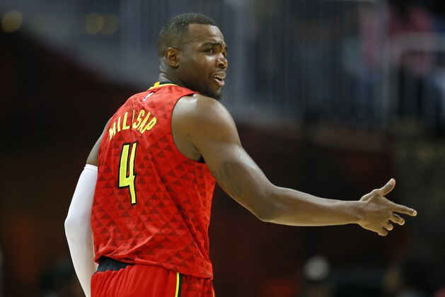 Atlanta Hawks forward Paul Millsap (4) reacts in the first half of an NBA basketball game against the Cleveland Cavaliers on Sunday, April 9, 2017, in Atlanta. The Hawks won in overtime 126-125. (AP Photo/Todd Kirkland)