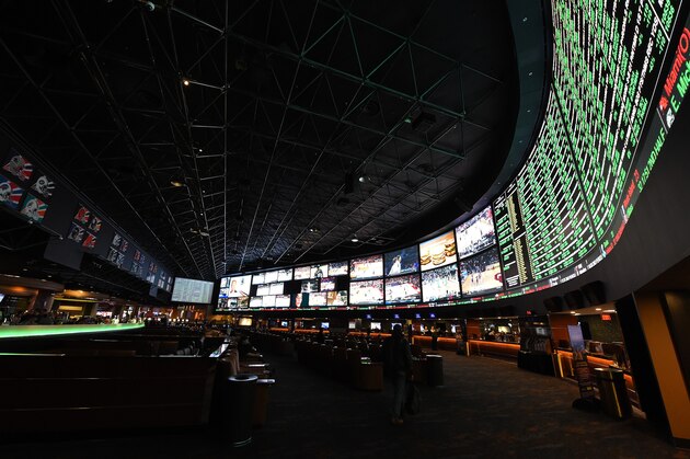 LAS VEGAS, NV - FEBRUARY 02:  The betting line and some of the nearly 400 proposition bets for Super Bowl 50 between the Carolina Panthers and the Denver Broncos are displayed at the Race & Sports SuperBook at the Westgate Las Vegas Resort & Casino on February 2, 2016 in Las Vegas, Nevada. The newly renovated sports book has the world's largest indoor LED video wall with 4,488 square feet of HD video screens measuring 240 feet wide and 20 feet tall.  (Photo by Ethan Miller/Getty Images)