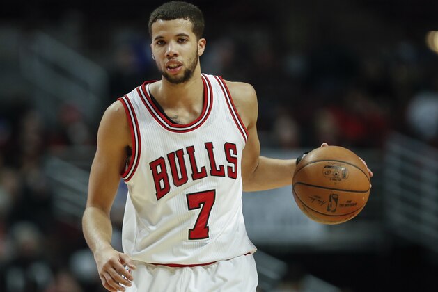 Chicago Bulls guard Michael Carter-Williams directs his team against the Charlotte Hornets during the second half of an NBA basketball game, Monday, Jan. 2, 2017, in Chicago. (AP Photo/Kamil Krzaczynski)