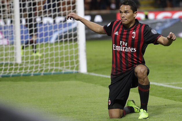 AC Milan's Carlos Bacca celebrates after scoring his side's second goal during a Serie A soccer match between AC Milan and Chievo Verona, at the San Siro stadium in Milan, Italy, Saturday, March 4, 2017. (AP Photo/Luca Bruno)