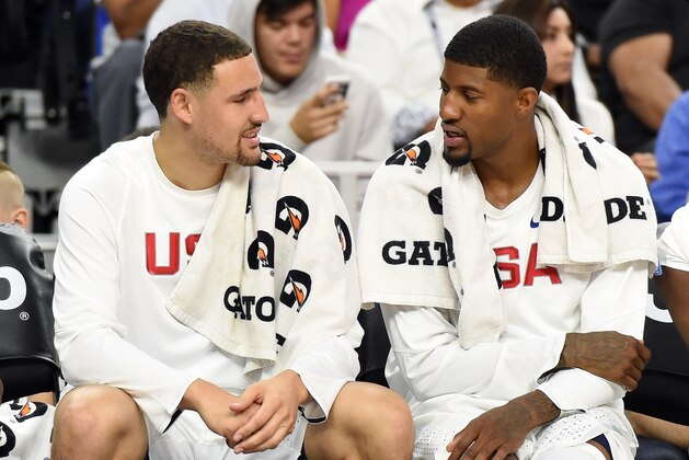 LAS VEGAS, NV - JULY 22:  Klay Thompson (L) #11 and Paul George #13 of the United States talk on the bench during a USA Basketball showcase exhibition game against Argentina at T-Mobile Arena on July 22, 2016 in Las Vegas, Nevada. The United States won 111-74.  (Photo by Ethan Miller/Getty Images)