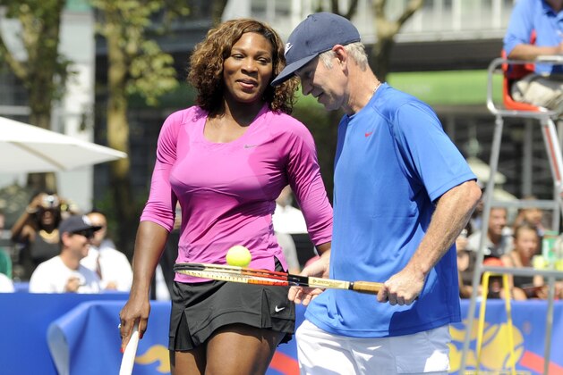 NEW YORK - AUGUST 26: Serena Williams talks with John McEnroe during their match at the DIRECTV ESPN US Open Experience promoting DIRECTV's mosaic coverage of the US Open August 26, 2009 at Bryant Park in New York Cty. (Rob Tringali/Getty Images for DirecTV)