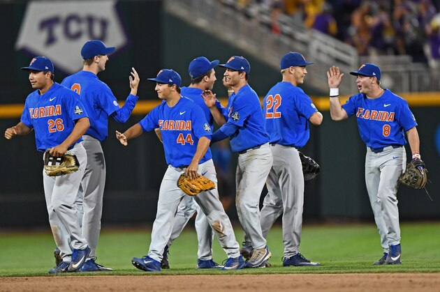 OMAHA, NE - JUNE 26:  The Florida Gators celebrate after beating the LSU Tigers 4-3 in game one of the College World Series Championship Series on June 26, 2017 at TD Ameritrade Park in Omaha, Nebraska.  (Photo by Peter Aiken/Getty Images)