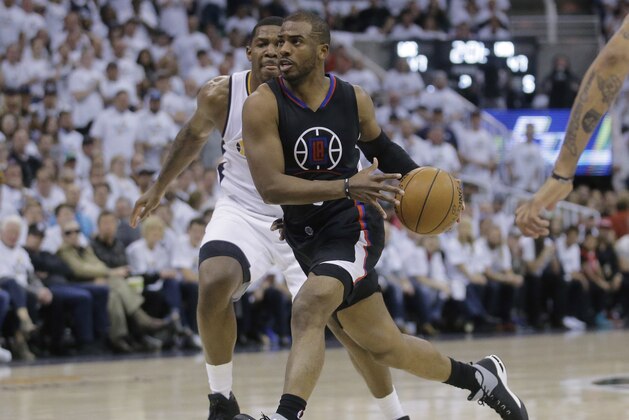 Los Angeles Clippers guard Chris Paul (3) drives to the as Utah Jazz forward Joe Johnson, rear, defends during the first half in Game 4 of an NBA basketball first-round playoff series Sunday, April 23, 2017, in Salt Lake City. (AP Photo/Rick Bowmer)