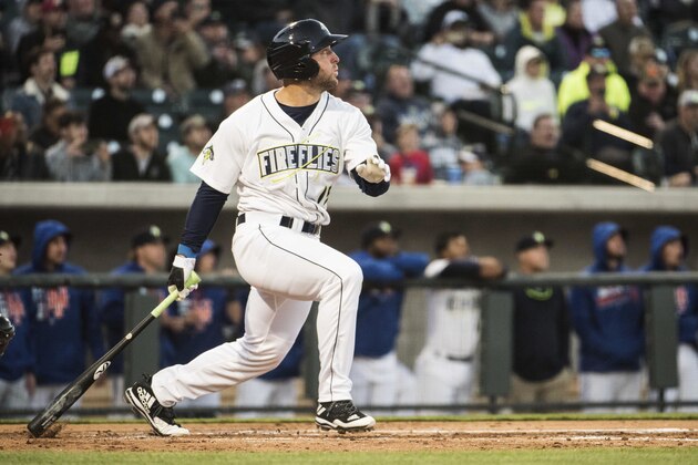 Columbia Fireflies' Tim Tebow watches his home run in his first at bat on the opening day during a Class A minor league baseball game against the Augusta GreenJackets on Thursday, April 6, 2017, in Columbia, S.C. (AP Photo/Sean Rayford)