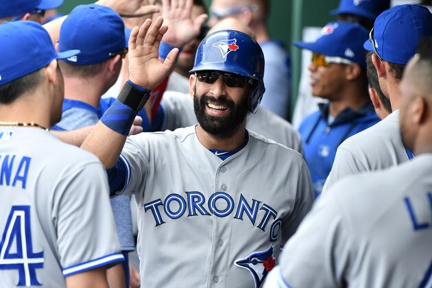 KANSAS CITY, MO - JUNE 25: Jose Bautista #19 of the Toronto Blue Jays celebrates with teammates after scoring on a Josh Donaldson #20 two-run double in the sixth inning against the Kansas City Royals at Kauffman Stadium on June 25, 2017 in Kansas City, Missouri. (Photo by Ed Zurga/Getty Images)