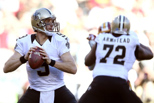 LANDOVER, MD - NOVEMBER 15: Quarterback Drew Brees #9 of the New Orleans Saints passes while tackle Terron Armstead #72 of the New Orleans Saints blocks against the Washington Redskins in the second quarter at FedExField on November 15, 2015 in Landover, Maryland. (Photo by Matt Hazlett/Getty Images)