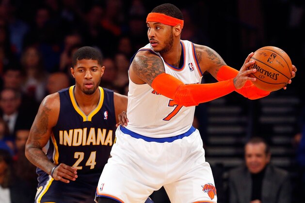 NEW YORK, NY - MARCH 19:  (NEW YORK DAILIES OUT)    Carmelo Anthony #7 of the New York Knicks in action against Paul George #24 of the Indiana Pacers at Madison Square Garden on March 19, 2014 in New York City. The Knicks defeated the Pacers 92-86. NOTE TO USER: User expressly acknowledges and agrees that, by downloading and/or using this Photograph, user is consenting to the terms and conditions of the Getty Images License Agreement.  (Photo by Jim McIsaac/Getty Images)