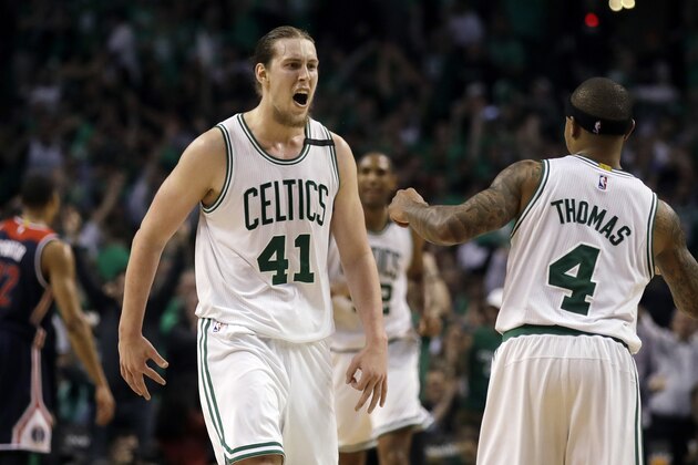 Boston Celtics center Kelly Olynyk (41) celebrates his basket with guard Isaiah Thomas (4) during the fourth quarter of Game 7 of a second-round NBA basketball playoff series against the Washington Wizards, Monday, May 15, 2017, in Boston. (AP Photo/Charles Krupa)