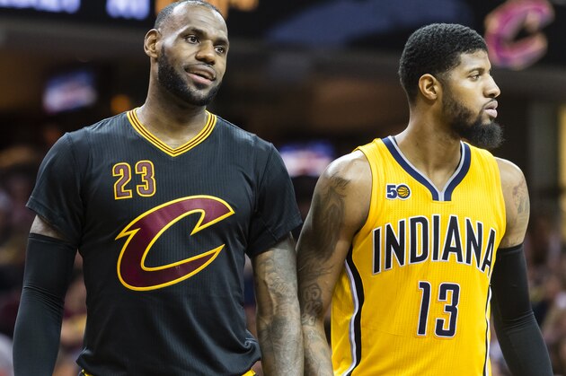 CLEVELAND, OH - FEBRUARY 15: Myles Turner #33 of the Indiana Pacers LeBron James #23 of the Cleveland Cavaliers and Paul George #13 of the Indiana Pacers pause on the court during the second half at Quicken Loans Arena on February 15, 2017 in Cleveland, Ohio. The Cavaliers defeated the Pacers 113-104. NOTE TO USER: User expressly acknowledges and agrees that, by downloading and/or using this photograph, user is consenting to the terms and conditions of the Getty Images License Agreement. (Photo by Jason Miller/Getty Images)