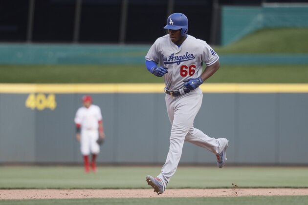 Los Angeles Dodgers' Yasiel Puig runs the bases after hitting a solo home run off Cincinnati Reds relief pitcher Jake Buchanan in the eighth inning of a baseball game, Saturday, June 17, 2017, in Cincinnati. The Dodgers won 10-2. (AP Photo/John Minchillo)