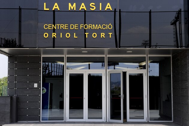 Entry of the new building named 'La Masia' of the training centre Oriol Tort where young players of the Barcelona football club live and train, near the Camp Nou stadium in Barcelona  on August 5, 2011 .  AFP PHOTO/ JOSEP LAGO (Photo credit should read JOSEP LAGO/AFP/Getty Images)