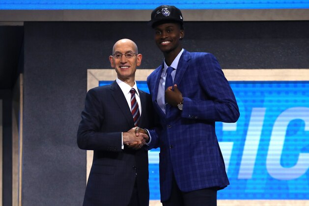 NEW YORK, NY - JUNE 22:  Jonathan Isaac walks on stage with NBA commissioner Adam Silver after being drafted sixth overall by the Orlando Magic during the first round of the 2017 NBA Draft at Barclays Center on June 22, 2017 in New York City. NOTE TO USER: User expressly acknowledges and agrees that, by downloading and or using this photograph, User is consenting to the terms and conditions of the Getty Images License Agreement.  (Photo by Mike Stobe/Getty Images)