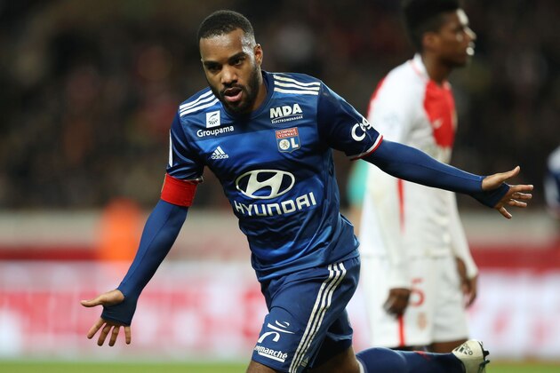 Lyon's French forward Alexandre Lacazette celebrates after scoring a goal during the French L1 football match between AS Monaco and Lyon at the Louis II Stadium in Monaco on December 18, 2016. / AFP / VALERY HACHE        (Photo credit should read VALERY HACHE/AFP/Getty Images)