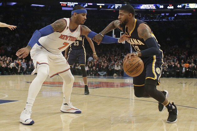 New York Knicks' Carmelo Anthony (7) defends Indiana Pacers' Paul George (13) during the first half of an NBA basketball game Tuesday, March 14, 2017, in New York. (AP Photo/Frank Franklin II)