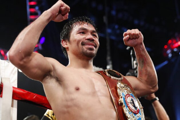 FILE - In this Nov. 5, 2016 file photo, Manny Pacquiao, of the Philippines, celebrates after defeating Jessie Vargas in their WBO welterweight title boxing match, in Las Vegas. Pacquiao will fight Australian Jeff Horn on July 2 at Brisbane’s 52,500-capacity Suncorp Stadium in a defense of Pacquiao’s WBO welterweight title. (AP Photo/Isaac Brekken, File)