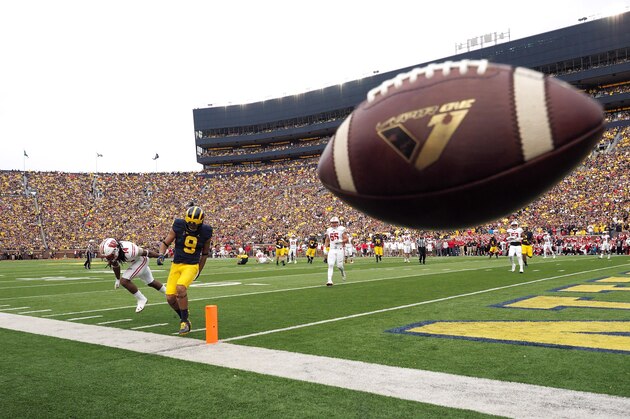 Michigan wide receiver Grant Perry (9) has a pass intended to him be broken up by Wisconsin safety D'Cota Dixon (14) in the second quarter of an NCAA college football game at Michigan Stadium in Ann Arbor, Mich., Saturday, Oct. 1, 2016. Michigan won 14-7. (AP Photo/Tony Ding)