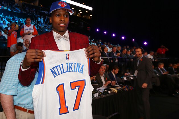 Jun 22, 2017; Brooklyn, NY, USA; Frank Ntilikina of France holds up a team jersey after being introduced as the number eight overall pick to the New York Knicks in the first round of the 2017 NBA Draft at Barclays Center. Mandatory Credit: Brad Penner-USA TODAY Sports