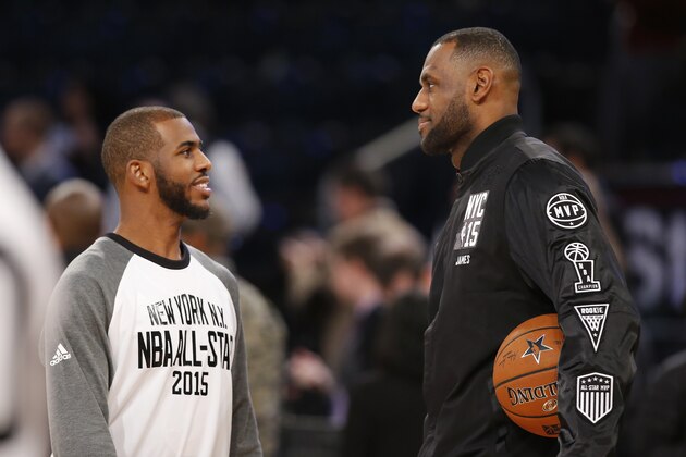 East Team's LeBron James, right, of the Cleveland Cavaliers, talks to West Team's Chris Paul, of the Los Angeles Clippers, prior to the start of the NBA All-Star basketball game, Sunday, Feb. 15, 2015, in New York. (AP Photo/Kathy Willens)