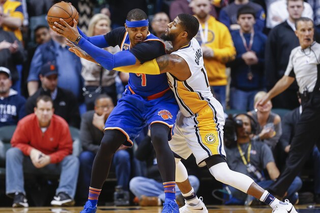 INDIANAPOLIS, IN - JANUARY 23: Carmelo Anthony #7 of the New York Knicks holds the ball as Paul George #13 of the Indiana Pacers reaches in at Bankers Life Fieldhouse on January 23, 2017 in Indianapolis, Indiana. NOTE TO USER: User expressly acknowledges and agrees that, by downloading and/or using this photograph, user is consenting to the terms and conditions of the Getty Images License Agreement. (Photo by Michael Hickey/Getty Images)