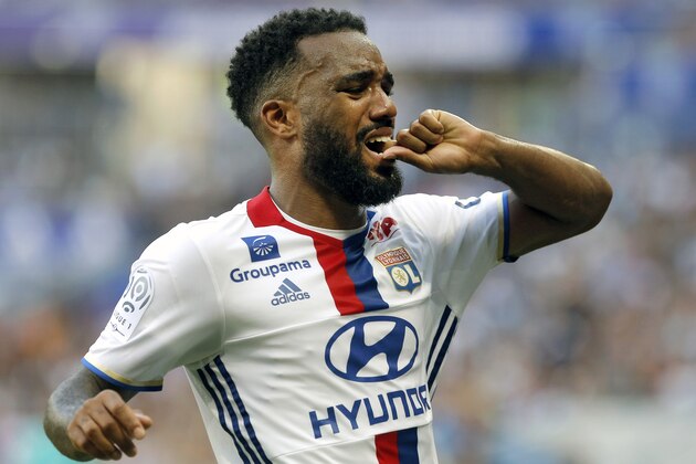 Lyon's Alexandre Lacazette reacts after being injured during their French League One soccer match against Bordeaux in Decines, near Lyon, central France, Saturday, Sept. 10, 2016. (AP Photo/Laurent Cipriani)