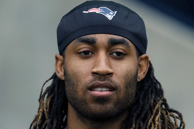 New England Patriots defensive back Stephon Gilmore walks onto the field for an NFL football organized team activities practice Thursday, May 25, 2017, in Foxborough, Mass. (AP Photo/Bill Sikes)