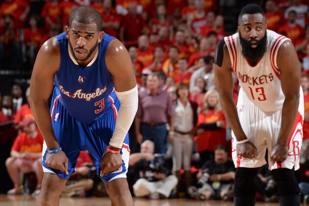 HOUSTON, TX - MAY 17:  Chris Paul #3 of the Los Angeles Clippers stands on the court in Game Seven of the Western Conference Semifinals with James Harden #13 of the Houston Rockets during the 2015 NBA Playoffs on May 17, 2015 at the Toyota Center in Houston, Texas. NOTE TO USER: User expressly acknowledges and agrees that, by downloading and or using this photograph, User is consenting to the terms and conditions of the Getty Images License Agreement. Mandatory Copyright Notice: Copyright 2015 NBAE (Photo by Andrew D. Bernstein/NBAE via Getty Images)